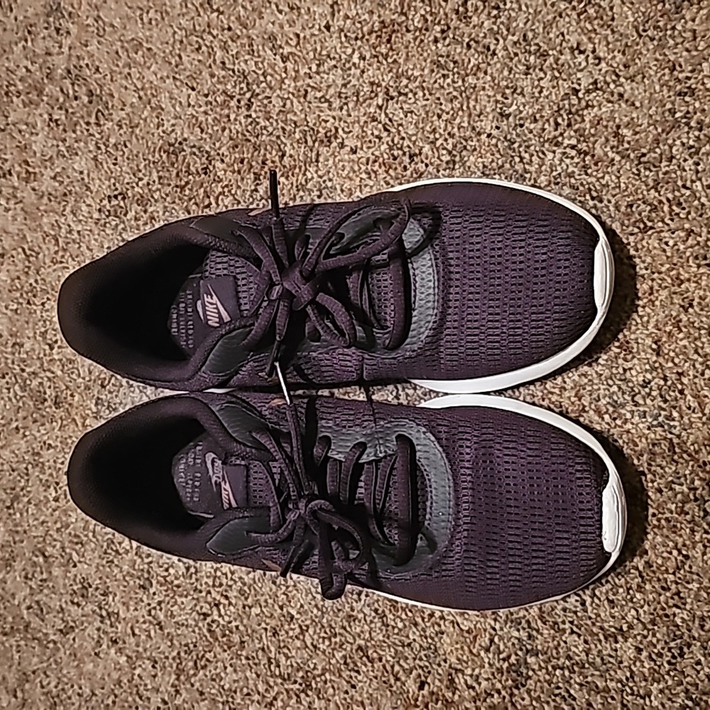Women's Nike Plum and Rose Gold tennis shoes.